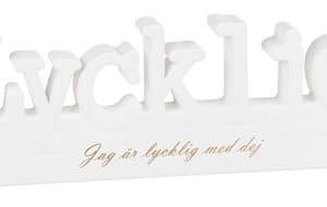Skylt Lycklig